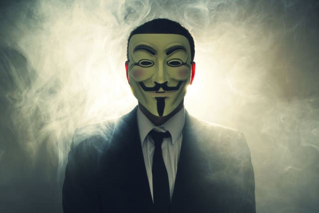 The masked face of international hacker Anonymous (photo credit: WIKIMEDIA)