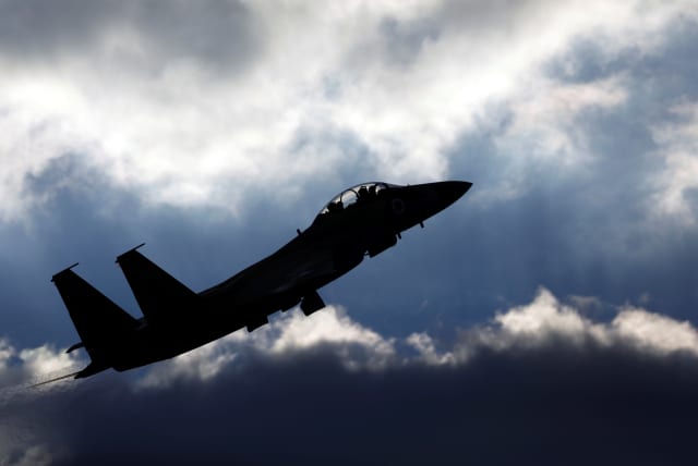 An Israeli Air Force F-15 fighter jet flies during an aerial demonstration (photo credit: AMIR COHEN - REUTERS)