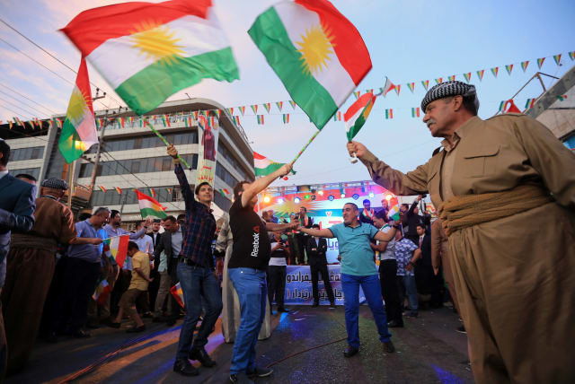 Kurds celebrate to show their support for the independence referendum in Duhok, Iraq, September 26, 2017. (photo credit: REUTERS)