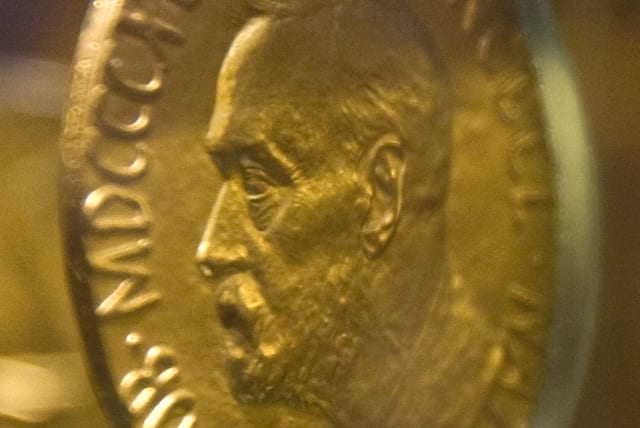 An 18-carat gold Nobel Peace Prize medal, awarded in 1921 to Norway's Christian L. Lange, is seen in an exhibition at the Nobel Peace Centre in Oslo December 9, 2009. (photo credit: REUTERS)