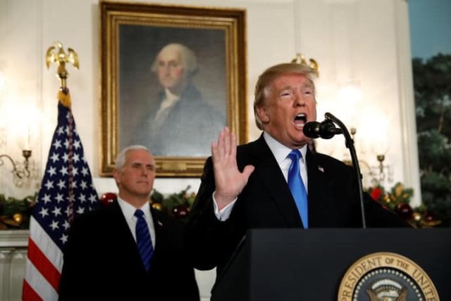 With Vice President Mike Pence looking on, US President Donald Trump gives a statement on Jerusalem, during which he recognized Jerusalem as the capital of Israel, in the Diplomatic Reception Room of the White House in Washington, US, December 6, 2017 (photo credit: REUTERS/KEVIN LAMARQUE)
