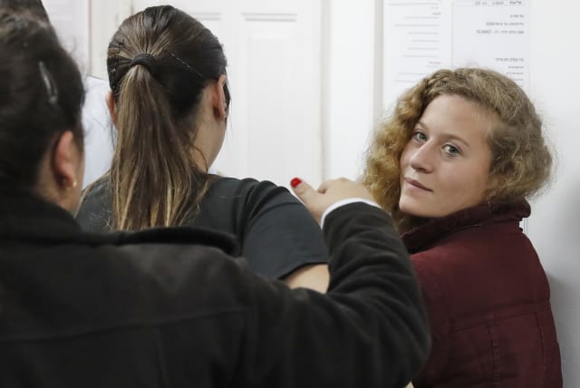 Ahed Tamimi appears at a military court at the Israeli-run Ofer prison in the West Bank village of Betunia on December 20, 2017. (photo credit: AHMAD GHARABLI / AFP)