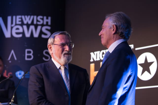 Former prime minister Tony Blair presents Lord Rabbi Jonathan Sacks with a Lifetime Achievement award at the Jewish News' Night of Heroes (photo credit: BLAKE EZRA PHOTOGRAPHY)