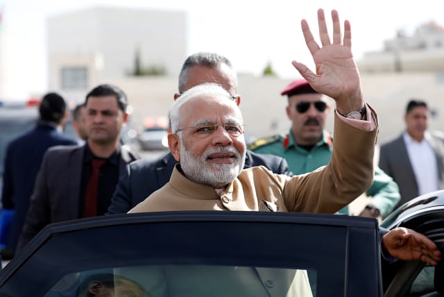India's Prime Minister Narendra Modi waves upon his arrival to meet with Palestinian President Mahmoud Abbas (not pictured) in Ramallah, in the West Bank February 10, 2018. (photo credit: REUTERS/MOHAMAD TOROKMAN)