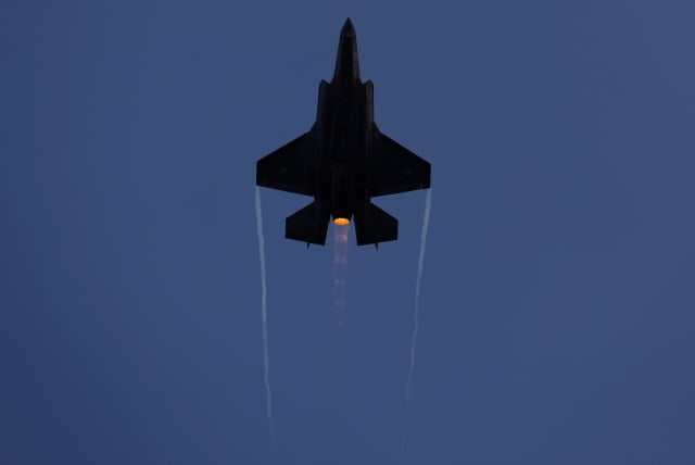 An Israeli Air Force F-35 fighter jet flies during an aerial demonstration at a graduation ceremony for Israeli air force pilots  (photo credit: REUTERS/AMIR COHEN)