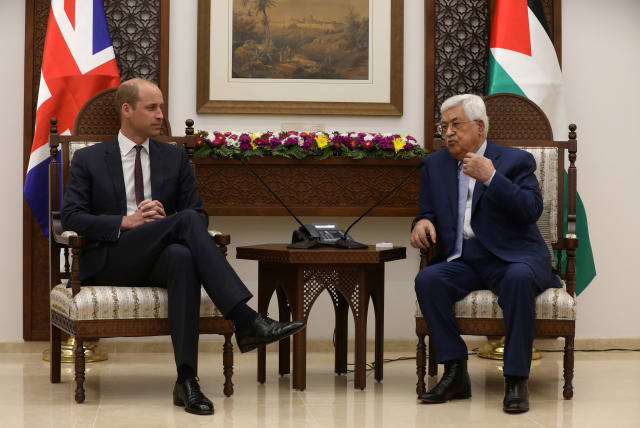 Palestinian President Mahmoud Abbas gestures during his meeting with Britain's Prince William in Ramallah, June 27, 2018 (photo credit: ALAA BADARNEH/POOL VIA REUTERS)