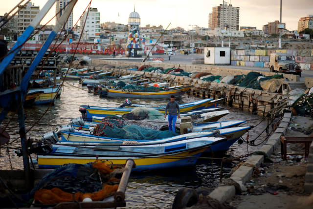A Palestinian fisherman stands in a boat at the seaport of Gaza City September 26, 2016 (photo credit: REUTERS/MOHAMMED SALEM)