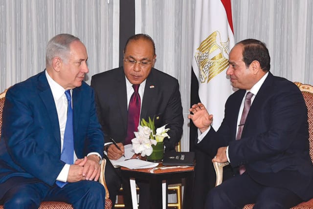 Egyptian President Abdel Fattah al-Sisi (right) speaks with Prime Minister Benjamin Netanyahu during their meeting ahead of the UN General Assembly last September (2017). (photo credit: REUTERS)