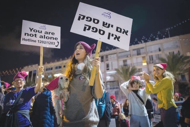 Demonstrators in Tel Aviv protest violence against women at a rally last night, marking the International Day for the Elimination of Violence against Women.  (photo credit: MIRIAM ALSTER/FLASH90)