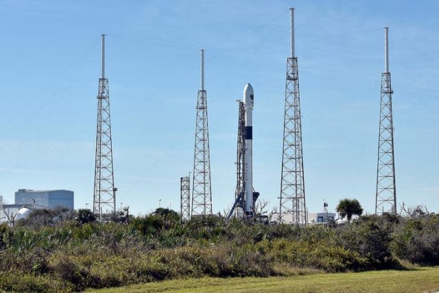 The SpaceX Falcon 9 rocket, scheduled to launch a U.S. Air Force navigation satellite, sits on Launch Complex 40 after the launch was postponed after an abort procedure was triggered by the onboard flight computer, at Cape Canaveral, Florida, U.S. (photo credit: REUTERS/STEVE NESIUS)
