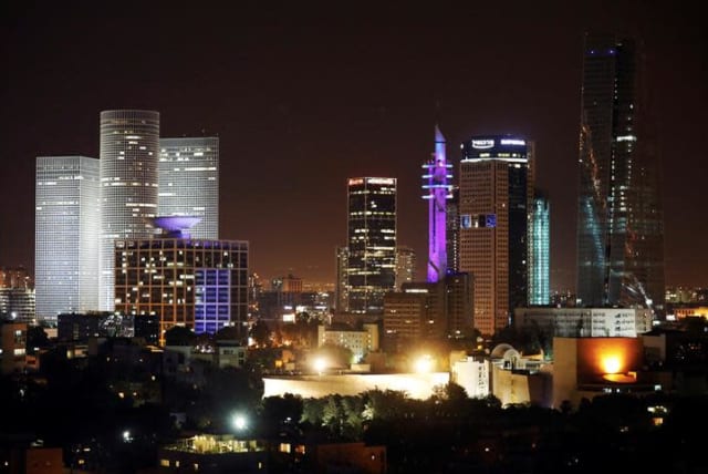 A cityscape of Tel Aviv is seen during the night-time in Israel May 27, 2017. Picture taken May 27, 2017. (photo credit: REUTERS/AMIR COHEN)