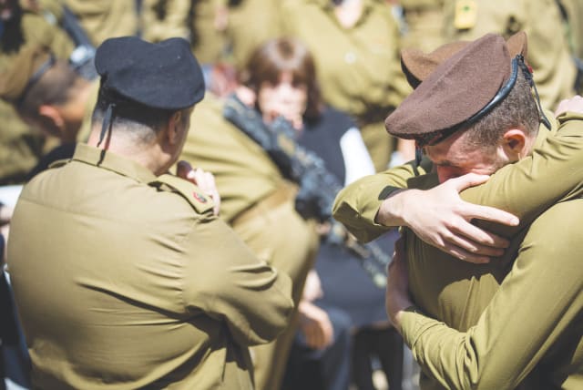 FRIENDS AND FAMILY mourn at the funeral of American lone soldier Alex Sasaki at the Mount Herzl Military Cemetery in Jerusalem, in March.  (photo credit: YONATAN SINDEL/FLASH 90)