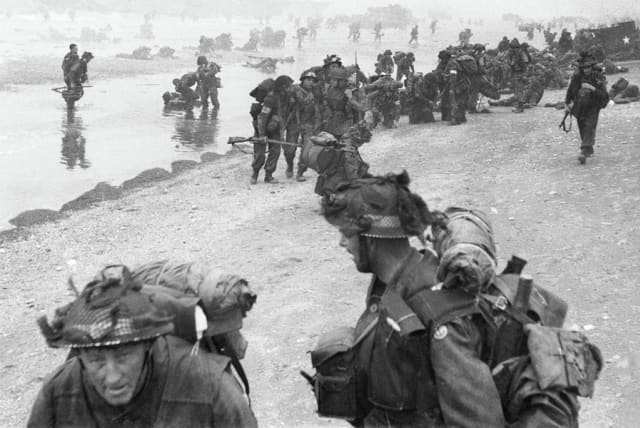 BRITISH FORCES during the D-Day invasion of Normandy on June 6, 1944: Troops of the 3rd Infantry Division on Queen Red Beach. (photo credit: Wikimedia Commons)