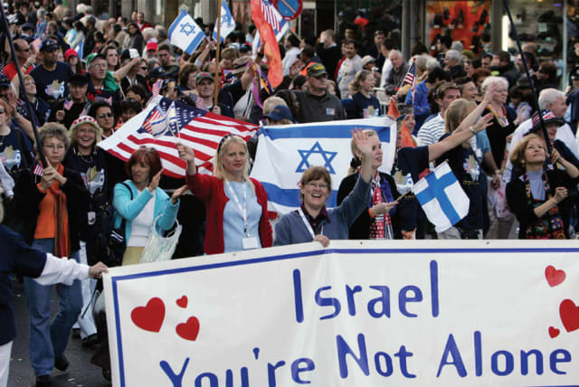Thousands of Christian supporters of Israel march in Jerusalem in the annual Feast of Tabernacles parade in 2019 (photo credit: MARC ISRAEL SELLEM)