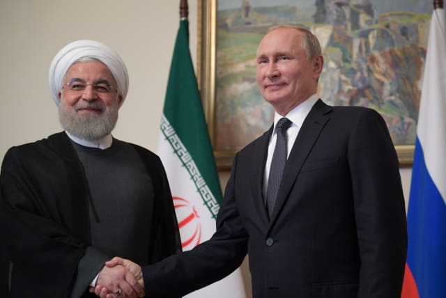 Russian President Vladimir Putin shakes hands with Iranian President Hassan Rouhani during a meeting on the sidelines of a session of the Supreme Eurasian Economic Council In Yerevan, Armenia October 1, 2019 (photo credit: REUTERS)