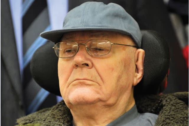 John Demjanjuk arrives in a court room for the continuation of his trial in Munich on January 13, 2010. (photo credit: ANDREAS GEBERT/REUTERS)