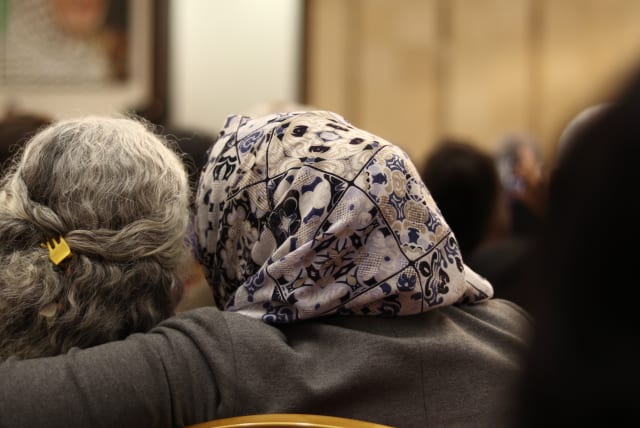 A Jewish woman and a Muslim one hugging in the Ramallah Muqata'a (photo credit: LEON SVERDLOV)