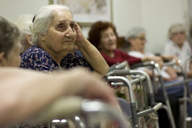 Elderly Israelis sit in a designated protected space in a senior citizens home in Jerusalem, June 2, 2009, as a siren is sounded during a nationwide civil defense drill simulating a rocket attack. 