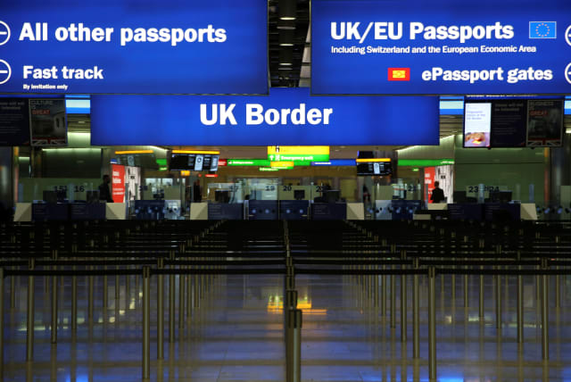 FILE PHOTO: UK Border control is seen in Terminal 2 at Heathrow Airport in London (photo credit: REUTERS)