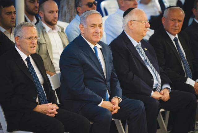 PRIME MINISTER Benjamin Netanyahu and President Reuven Rivlin attend a memorial ceremony for Ze’ev Jabotinsky at Mount Herzl in Jerusalem last year. (photo credit: FLASH90)