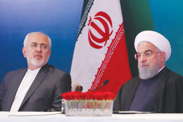 IRANIAN PRESIDENT Hassan Rouhani (right) and Foreign Minister Javad Zarif. Who wanted to pay the price of moral action to truly stop Iran? (photo credit: DANISH SIDDIQUI/ REUTERS)