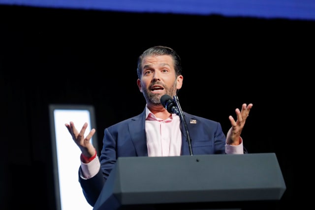 Donald Trump Jr. speaks to young people waiting to hear his father, U.S. President Donald Trump, deliver an "Address to Young Americans" at the Dream City Church in Phoenix, Arizona, U.S., June 23, 2020 (photo credit: REUTERS/CARLOS BARRIA)