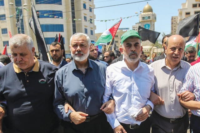 HAMAS LEADERS Ismail Haniyeh and Yahya Sinwar march to protest US President Donald Trump’s ‘Deal of the Century,’ in Gaza City in June 2019. (photo credit: HASSAN JEDI/FLASH90)