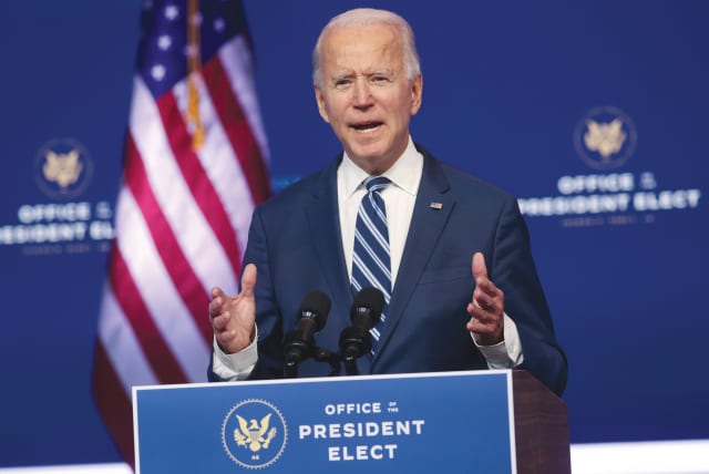 US PRESIDENT-ELECT Joe Biden speaks about healthcare at the theater serving as his transition headquarters in Wilmington, Delaware, on Tuesday. (photo credit: JONATHAN ERNST / REUTERS)