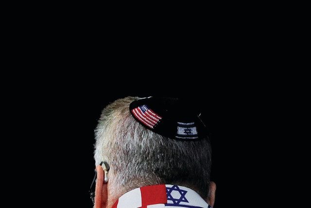 An AIPAC attendee sport a US-Israel themed suit (photo credit: TOM BRENNER/REUTERS)