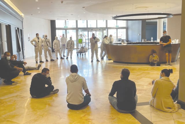 POLICE PREVENT detainees quarantining at Jerusalem’s Crowne Plaza Hotel from leaving. (photo credit: Courtesy)