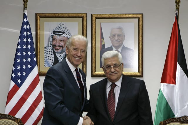 Then-vice president Joe Biden greets Palestinian Authority President Mahmoud Abbas in Ramallah on March 10, 2010. (photo credit: AMMAR AWAD/REUTERS)