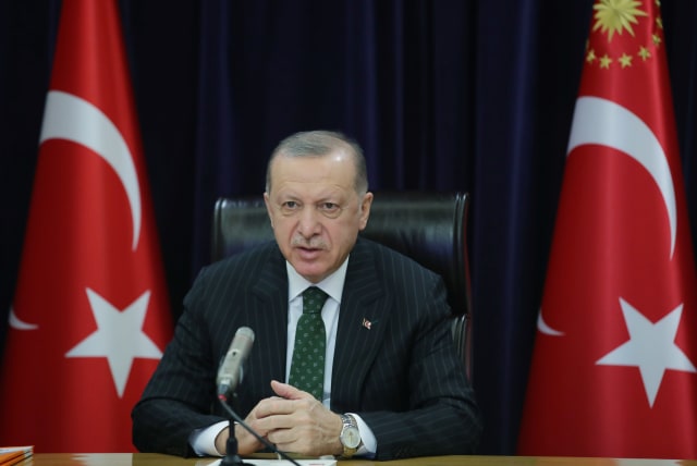 Turkish President Tayyip Erdogan attends a meeting of his ruling AK Party via video link in Ankara, Turkey March 4, 2021. (photo credit: PRESIDENTIAL PRESS OFFICE/HANDOUT VIA REUTERS)