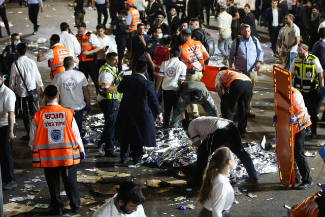 Israeli rescue forces and police near the scene after a stampede killed dozens during the celebrations of the Jewish holiday of Lag Baomer on Mt. Meron on April 30, 2021.  (photo credit: DAVID COHEN/FLASH 90)