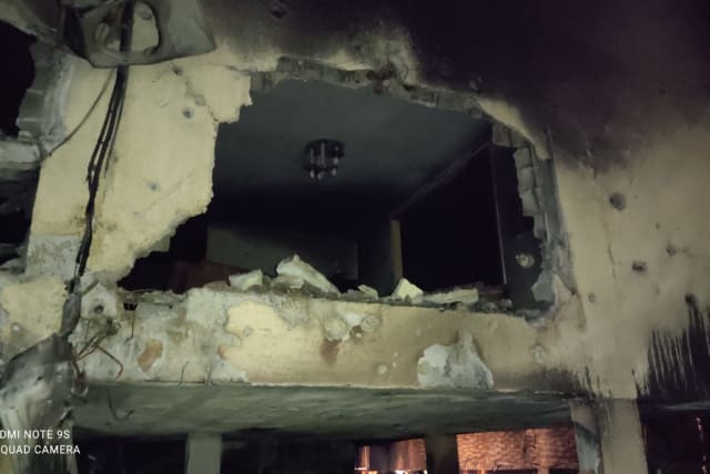Damage caused to a building in Petah Tikva by Hamas rocket fire, May 13, 2021 (photo credit: ALON HACHMON)