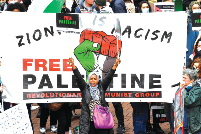 PRO-PALESTINIAN demonstrators attend a protest in London last weekend. (photo credit: TOBY MELVILLE/REUTERS)