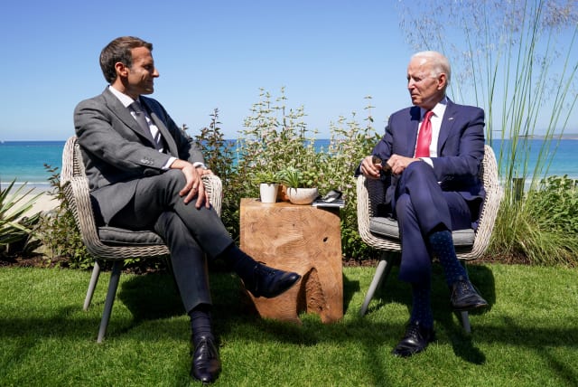 US President Joe Biden and France's President Emmanuel Macron attend a bilateral meeting during the G7 summit in Carbis Bay, Cornwall, Britain, June 12, 2021. (photo credit: KEVIN LAMARQUE/REUTERS)