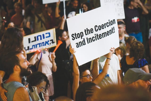  PROTESTORS IN Tel Aviv earlier this month object to the government's vaccination and Green Pass policies. (photo credit: AVSHALOM SASSONI/FLASH90)