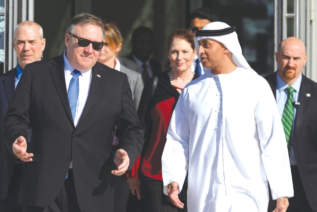  THEN-US SECRETARY of State Mike Pompeo speaks with the Emirati Ambassador to the US Yousef Al Otaiba in Abu Dhabi, in 2019 (photo credit: ANDREW CABALLERO-REYNOLDS/REUTERS)