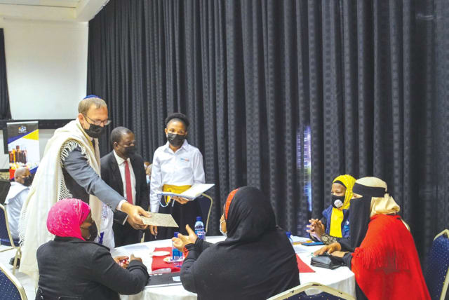  THE WRITER meets with local faith leaders in Mbabane, Eswatini during IsraAid’s coronavirus vaccine campaign in the African country. (photo credit: Ezzie Benjamin)
