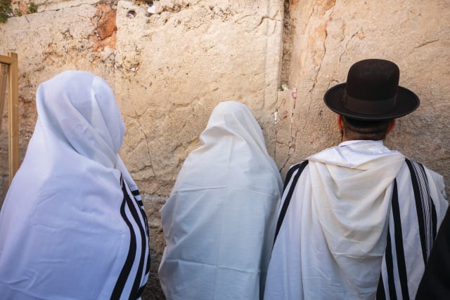 Worshipers pray at the Western Wall. (photo credit: OLIVIER FITOUSSI/FLASH90)