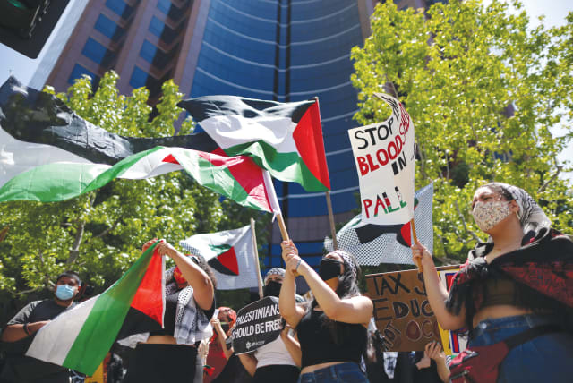  PRO-PALESTINE demonstrators protest outside the Israeli Consulate in Los Angeles in May. (photo credit: LUCY NICHOLSON / REUTERS)