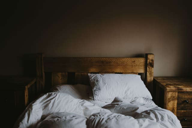  A lonely bed (illustrative) (photo credit: UNSPLASH)