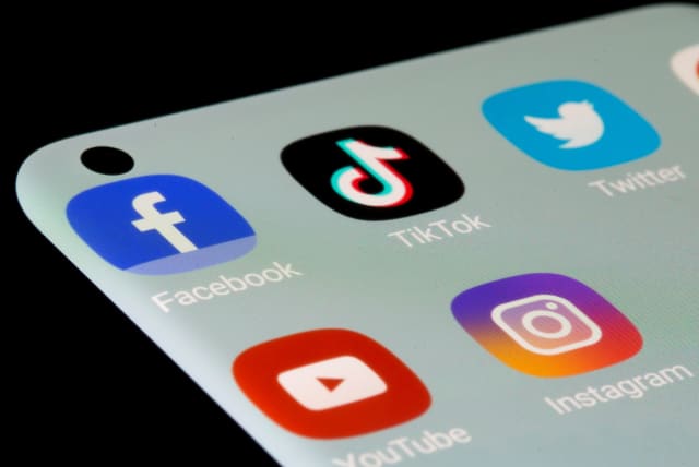  Facebook, TikTok, Twitter, YouTube and Instagram apps are seen on a smartphone in this illustration taken, July 13, 2021 (photo credit: REUTERS/DADO RUVIC)