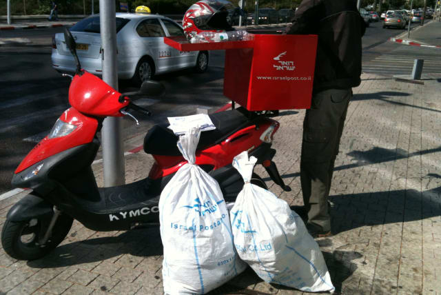  Israel Post postal worker delivers packages on his motorized scooter. (photo credit: VIA WIKIMEDIA COMMONS)