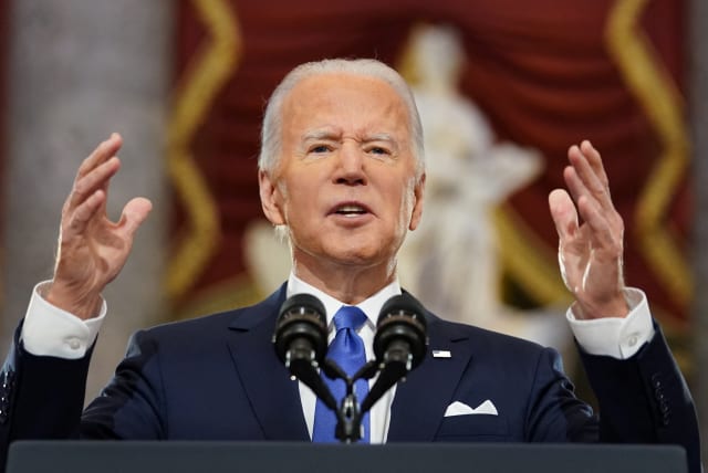 US President Joe Biden speaks in Statuary Hall on the first anniversary of the January 6, 2021 attack on the U.S. Capitol by supporters of former President Donald Trump, on Capitol Hill in Washington, US, January 6, 2022. (photo credit: REUTERS/KEVIN LAMARQUE)