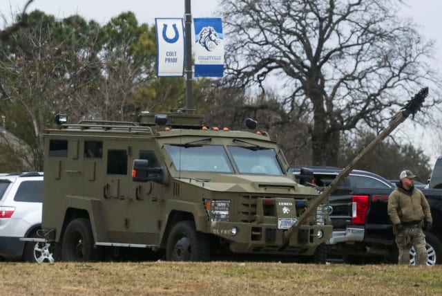 An armored law enforcement vehicle is seen in the area where a man has reportedly taken people hostage at a synagogue during services that were being streamed live, in Colleyville, Texas, US January 15, 2022.  (photo credit: REUTERS/Shelby Tauber)