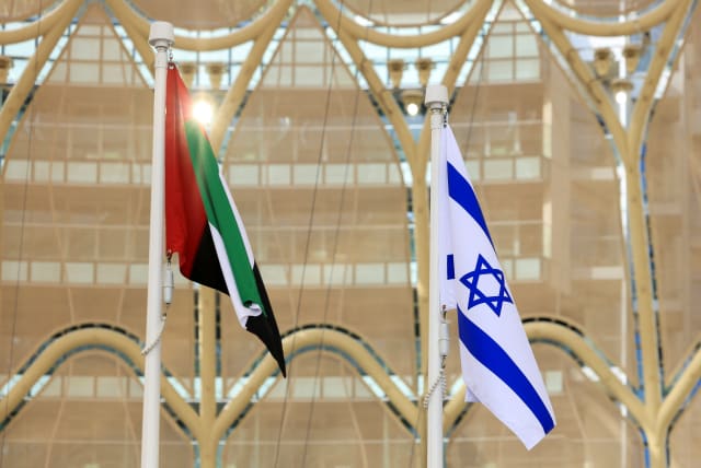  Flags of United Arab Emirates and Israel flutter during Israel's National Day ceremony at Expo 2020 Dubai, in Dubai (photo credit: REUTERS/CHRISTOPHER PIKE)