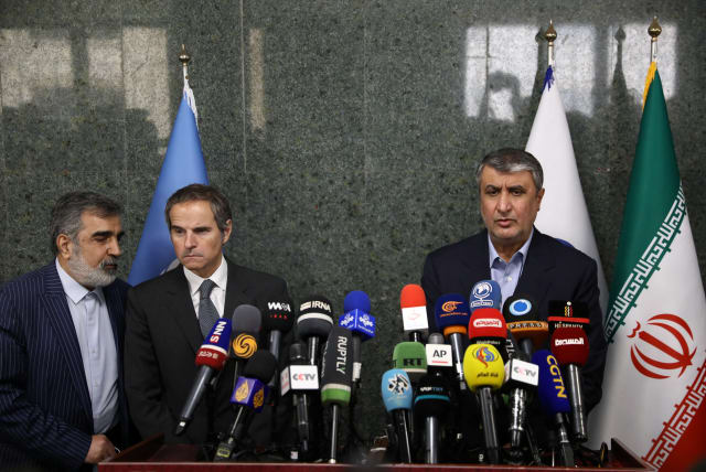  Head of Iran's Atomic Energy Organization Mohammad Eslami and International Atomic Energy Agency (IAEA) Director General Rafael Mariano Grossi attend a news conference, in Tehran, Iran, March 5, 2022. (photo credit: WANA VIA REUTERS)