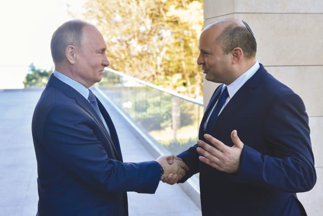  RIME MINISTER Naftali Bennett shakes hands with Russian President Vladimir Putin at a meeting in Sochi, last October. (photo credit: Sputnik/Kremlin/Reuters)