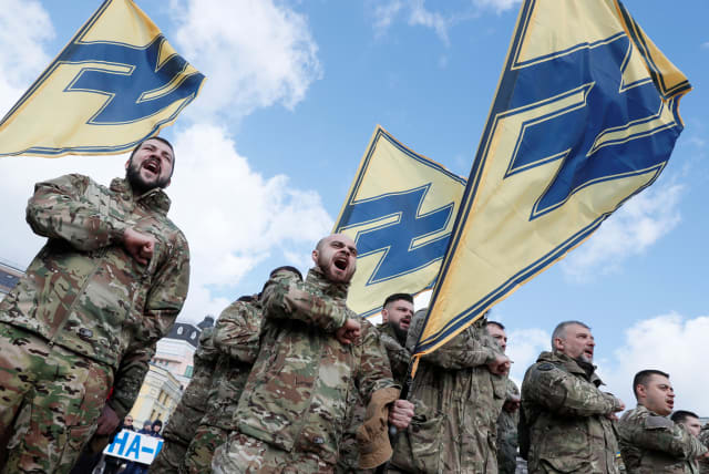  Members of Azov battalion attend a rally on the Volunteer Day honouring fighters, who joined the Ukrainian armed forces during a military conflict in the country's eastern regions, in central Kiev, Ukraine March 14, 2020. (photo credit: REUTERS/GLEB GARANICH)
